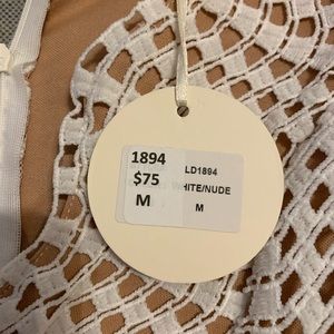 Beautiful white dress with tan lining.